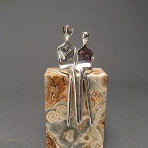 Silver Caress | Silver-Plated Sculpture of a Loving Couple | Silver Anniversary Present | Natural Travertine Stone Base | By Yenny Cocq