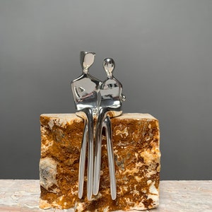 Silver Caress | Silver-Plated Sculpture of a Loving Couple | Silver Anniversary Present | Natural Travertine Stone Base | By Yenny Cocq