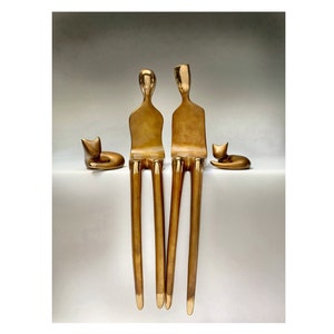 20” bronze sculpture man and woman with 2 cats, a larger and smaller cat. Unmounted sculpture for the mantle or interior wall.