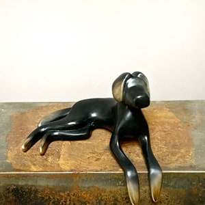 Black dog bronze sculpture. image 1
