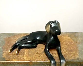 Black dog bronze sculpture.