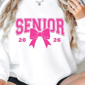 Senior 2026 Pink Bow Shirt, Trendy Graduation Tee, Cute Class of 2026 Long Sleeve, Cozy Senior Sweatshirt Gift for Her