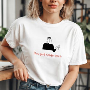 This Girl Needs Wine - T-Shirt - Funny Wine Lover Tee with Girl and Glass, Perfect Gift for Women, Wine Enthusiasts, Birthdays, or Holidays