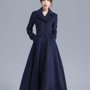 May include: A long, navy blue coat with a double-breasted closure and a flared skirt.