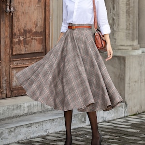 Knee length pleated tartan skirt crossword top
