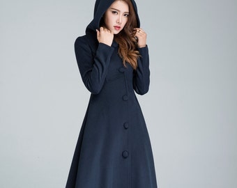 May include: A long, navy blue hooded coat with a button closure and a flared skirt. The coat is made of a soft, warm fabric and is perfect for cold weather.