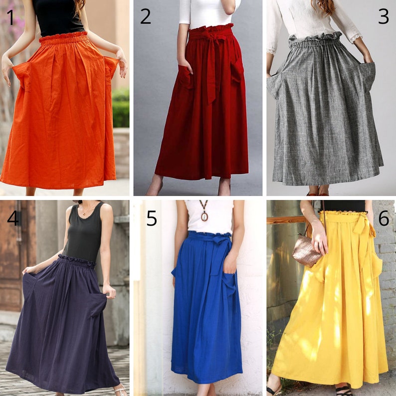 May include: Collection of six colorful, long skirts. The skirts are in various solid colors: orange, red, gray, navy, blue, and yellow. Each skirt has a high waist, pockets, and a flowing, A-line silhouette, suitable for casual wear.