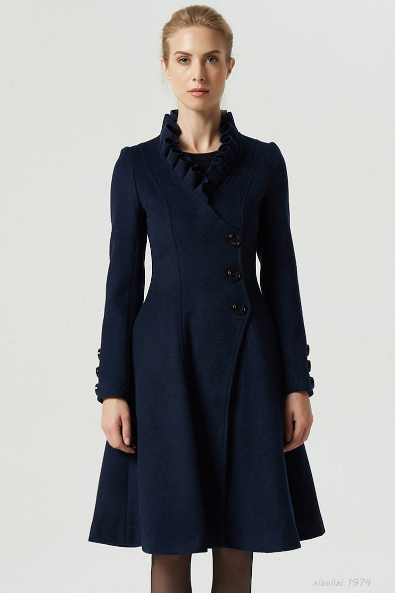 1960s Coats and Jackets     navy blue coat asymmetrical coat wool coat ruffle coat knee length coat buttoned coat fitted coat midi coat long sleeves coat 1974#  AT vintagedancer.com