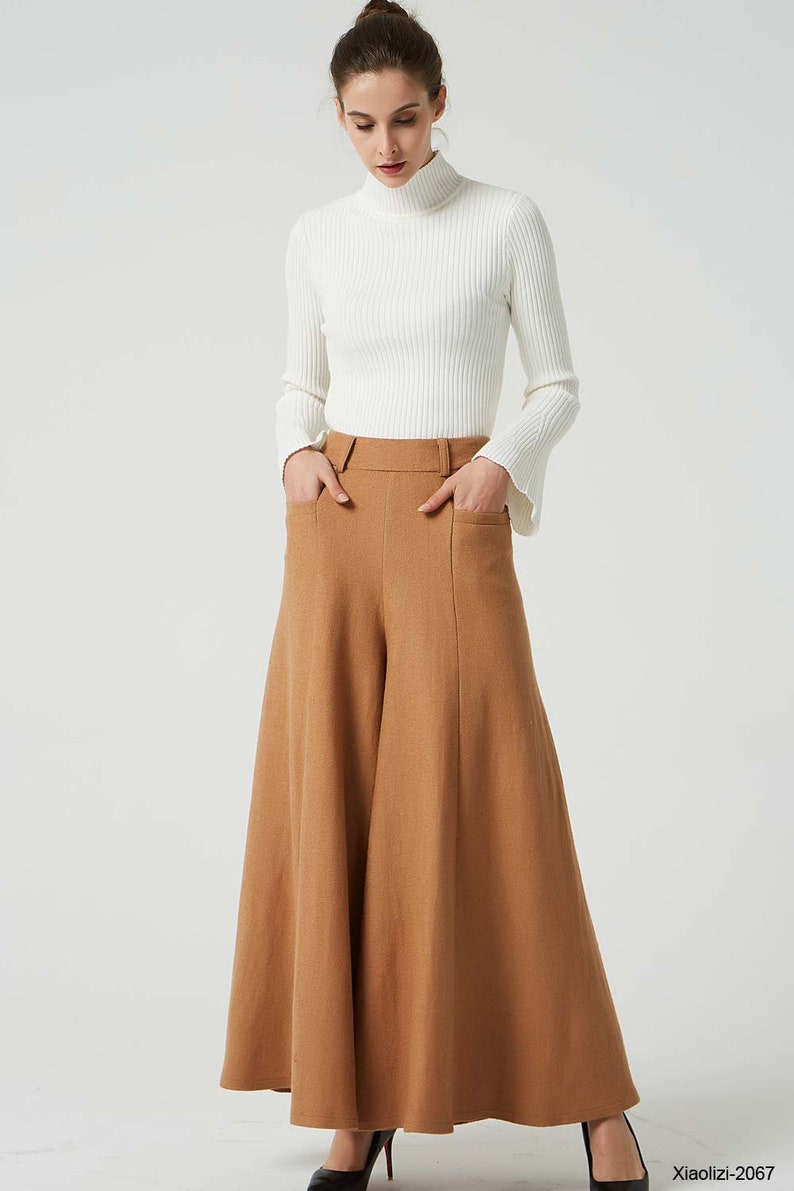 May include: A brown wide-leg pant with a high waist and pockets. The pant is made of a soft, textured fabric.