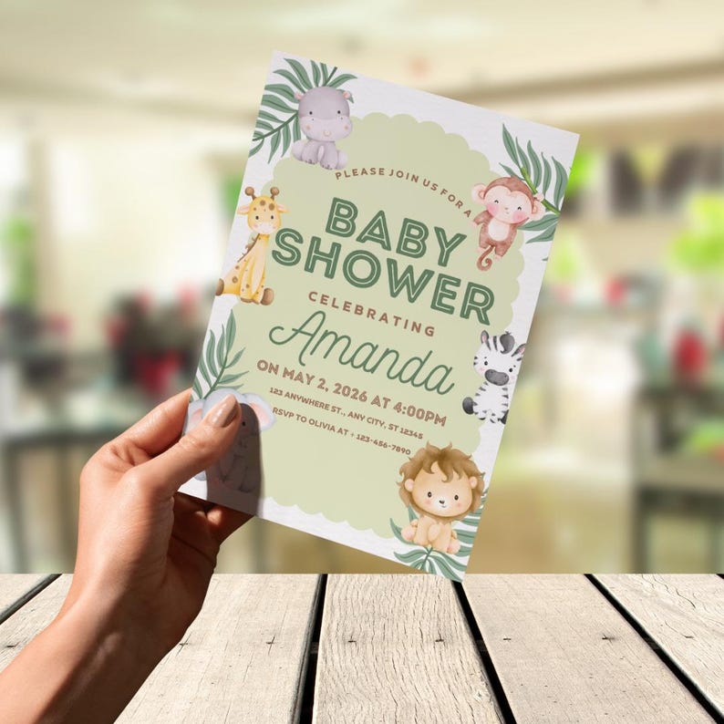 May include: A baby shower invitation with a light green background and jungle animal illustrations. The invitation includes the text "Baby Shower Celebrating Amanda" and event details. The design incorporates a giraffe, zebra, lion, monkey, and hippo.