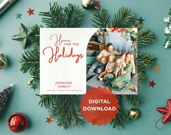 May include: A holiday-themed digital download card with a family photo, surrounded by Christmas decorations. The card reads "Home for the Holidays" in red script, with the family name below. A red "Digital Download" badge is also present.