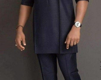May include: A navy blue long-sleeved shirt with a decorative design on the chest, paired with matching navy blue trousers.