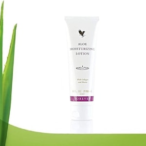 May include: A white tube of Forever Aloe Moisturizing Lotion with a purple label. The label says "Aloe Moisturizing Lotion" and "With Collagen and Elastin". The tube is 4 fl oz (118 ml).