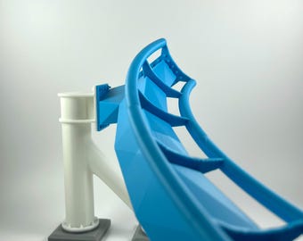 May include: A blue and white 3D printed model of a roller coaster track. The track is curved and has a support structure.