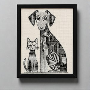May include: Black framed artwork featuring a stylized illustration of a dog and cat. The dog has a geometric pattern on its body, and the cat has striped markings. The artwork is in black and white.