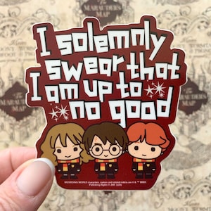 May include: A maroon sticker with the phrase "I solemnly swear that I am up to no good" in white text. The sticker features cartoon illustrations of three characters. The background is a map.
