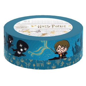 May include: A blue and gold Harry Potter themed washi tape roll with a cartoon image of Harry Potter casting a spell. The tape features a repeating pattern of stars, snowflakes, and a forest scene.