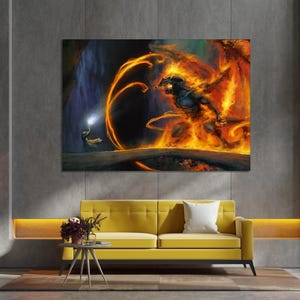 May include: A fiery orange and yellow creature with a dark blue body emerges from a cave, surrounded by flames and smoke. A small figure with a glowing staff stands in the background.