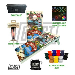 May include: A cornhole set featuring a Margaritaville design, including a carry case, score tower, Bluetooth LED lights, and all-weather resin bags. The set has a light green frame and a colorful graphic design.
