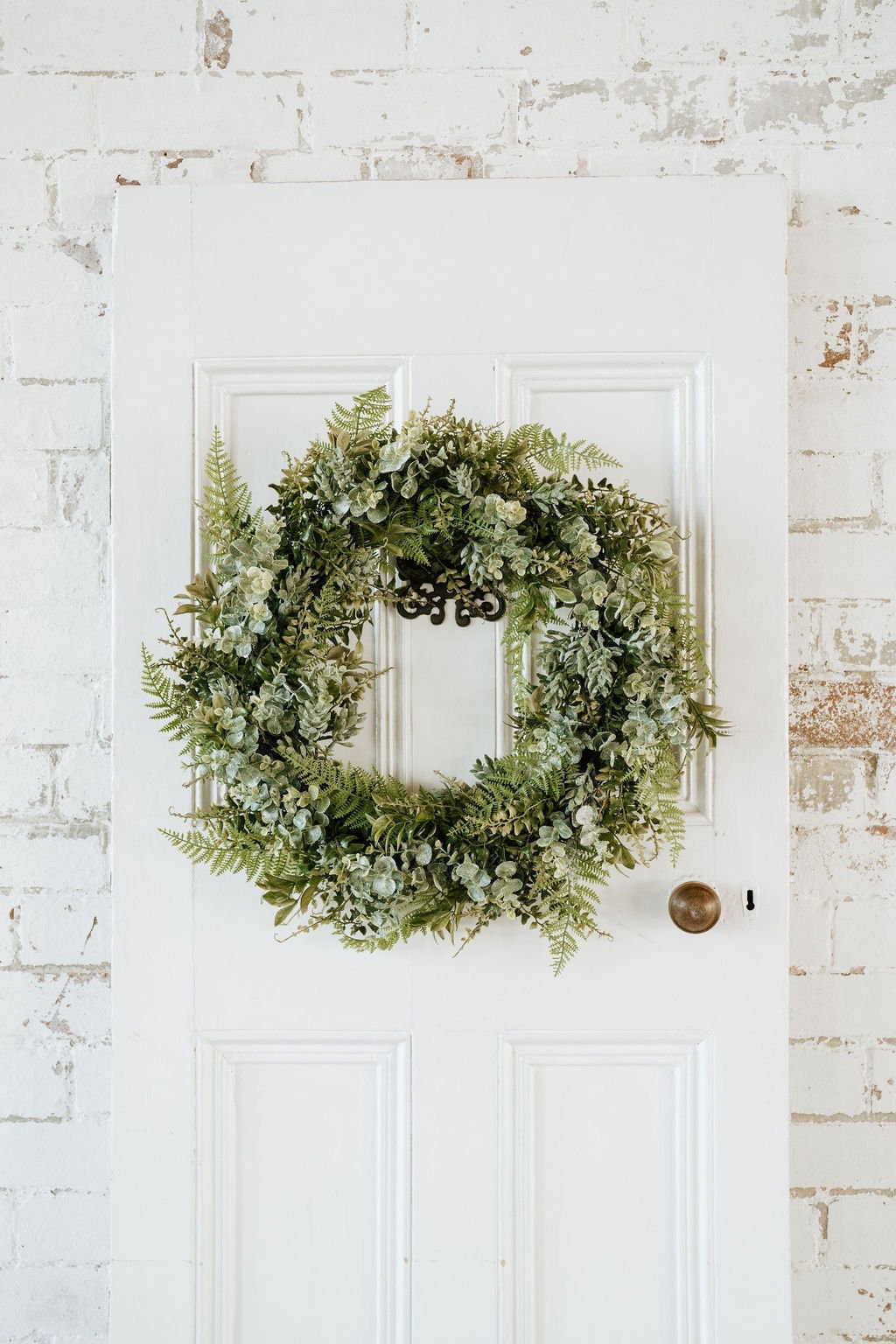 Image of Holly tone holly berry wreath on white door