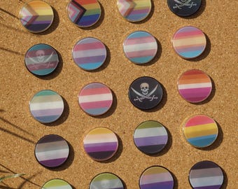 Lenticular LGBTQ+ Pride flag pin badge with different flags depending on viewing angle