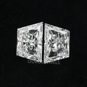 May include: Two clear princess-cut diamonds, set side-by-side, on a black background.  The diamonds are faceted and sparkle.