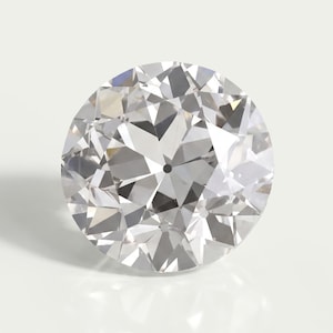 May include: A round, brilliant-cut clear gemstone featuring numerous triangular and kite-shaped facets that create a complex, reflective pattern. The stone is colorless and transparent, displaying sharp light refraction and internal depth.