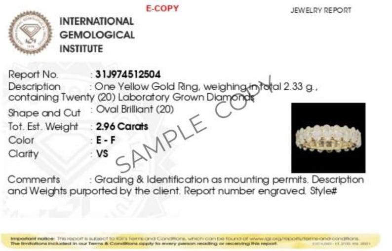 May include: A jewelry report for a yellow gold ring with twenty oval brilliant diamonds, weighing 2.96 carats. The report number is 31J974512504.