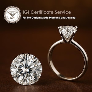 May include: A close-up of a diamond ring with a large, round, brilliant-cut diamond. The ring is set in a simple, silver band. The diamond is surrounded by smaller diamonds. The ring is on a brown surface. The image also shows a loose diamond on the left side of the image. The text "IGI Certificate Service" is at the top of the image. The text "For the Custom Made Diamond and Jewelry" is below the first line of text. The image also includes a logo for the International Gemological Institute (IGI).