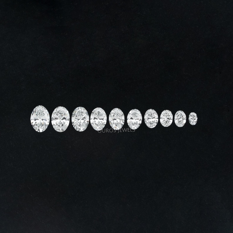 May include: A row of ten oval-shaped diamonds of varying sizes, arranged from largest to smallest, on a black background.