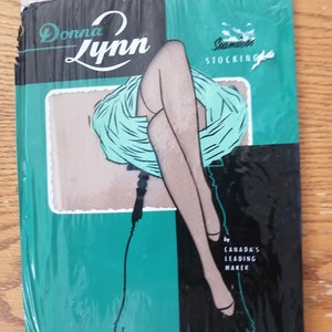 May include: A vintage package of Donna Lynn Seamless Stockings, featuring a woman's legs against a teal and black background. The text on the package reads "Donna Lynn Seamless Stocking by Canada's Leading Maker. Sheer Beauty - Proportionated to Fit."