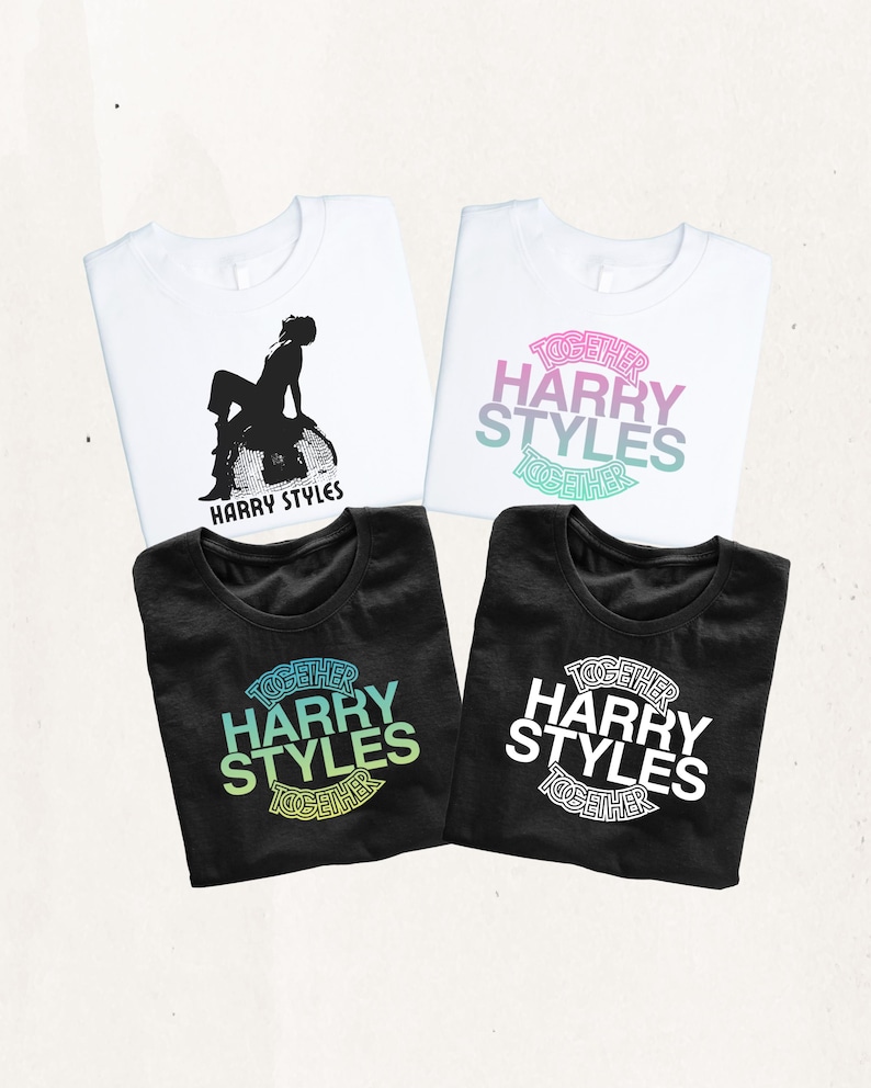 May include: Four t-shirts featuring Harry Styles graphics. Two white shirts, one with a black silhouette of a person sitting on a disco ball and one with pink, purple, and teal text. Two black shirts with green or white text reading TOGETHER HARRY STYLES.