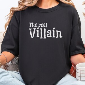 Embrace your inner mischief with our Comfort Colors T-shirt featuring The Villain printed boldly across the chest.
