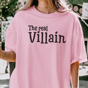 Embrace your inner mischief with our Comfort Colors T-shirt featuring The Villain printed boldly across the chest.
