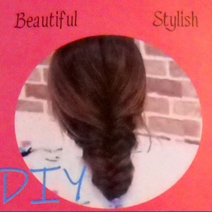 May include: A fishtail braid hairstyle, framed by a pink border with the words "Beautiful" and "Stylish" at the top and "DIY" at the bottom. The background is a brick wall.