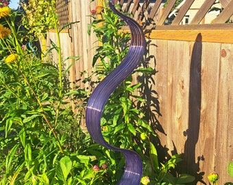 Hand blown glass wave ribbon, purple with purple highlights.