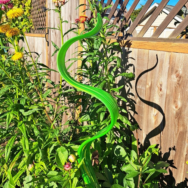 Hand blown garden art wave ribbon, green with green highlights.