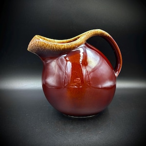 May include: A set of three ceramic mugs with a speckled, matte finish. The mugs are in shades of cream, light gray, and dark gray. Each mug has a simple, minimalist design and a rounded handle.