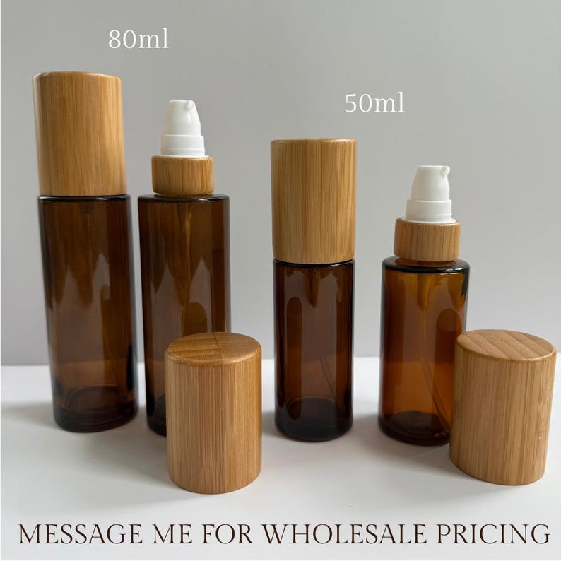 May include: Amber glass bottles with bamboo lids and spray tops. The bottles are available in 80ml and 50ml sizes. The image also includes the text "MESSAGE ME FOR WHOLESALE PRICING".