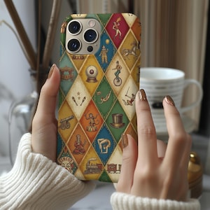 May include: A smartphone case featuring a colourful diamond-patterned design with various vintage circus-themed illustrations, including a fire breather, a unicyclist, a monkey, a cannon, a top hat, a train, and a crystal ball in shades of blue, red, and gold.