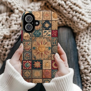 May include: A phone case with a colourful patchwork design featuring a sun, moon, and stars. The case has a camera cutout and is made of a durable material.