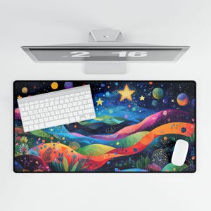 May include: A colourful mouse mat with a rainbow landscape design and a starry night sky. The mouse mat features a large star in the centre and a white keyboard in the foreground.