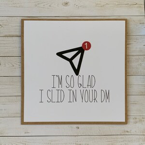 May include: A white card with a black paper airplane icon and a red notification circle with the number "1" inside. The text on the card reads "I'm so glad I slid in your DM."