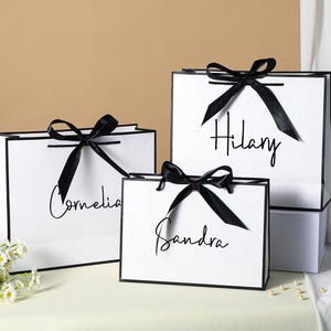 Sacchetti regalo personalizzati con nome, sacchetti regalo per compleanno, sacchetti per addio al nubilato, sacchetti regalo con cordino e nastro, sacchetti regalo di benvenuto, sacchetti regalo eleganti