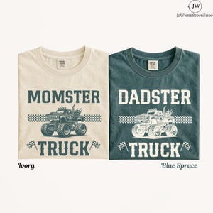 May include: Two t-shirts, one ivory and one blue spruce, each featuring a graphic of a monster truck with the text MOMSTER TRUCK or DADSTER TRUCK, accompanied by checkered flag patterns and a checkered finish line graphic printed on the front.