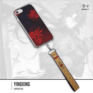 Puede incluir: Funda transparente para teléfono con un diseño floral rojo y negro y un cordón a juego. El cordón es de color beige con un patrón geométrico y detalles en rojo. El texto "YINGXING" y "LANYARD VER." está en la parte inferior.