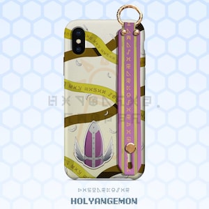 May include: A phone case with a strap featuring a shield design with wings, and the text "HOLYANGEMON". The case has a cream background with brown ribbons and gold accents. The strap is purple and yellow with gold text and a gold ring.