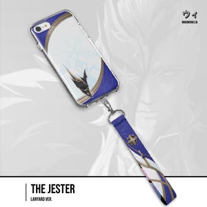 May include: A clear smartphone case featuring a white, blue, and gold graphic design with a black emblem, attached to a matching blue, white, and gold patterned fabric wrist lanyard. The design includes a gold circular border and a black pointed icon.