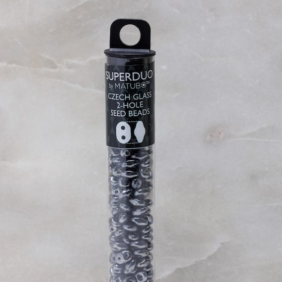 Jet Hematite - SuperDuo, 2.5x5mm 22g Jet Hematite - SuperDuo, 2.5x5mm 22g