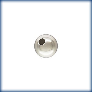 May include: A silver round bead with a hole in the center.